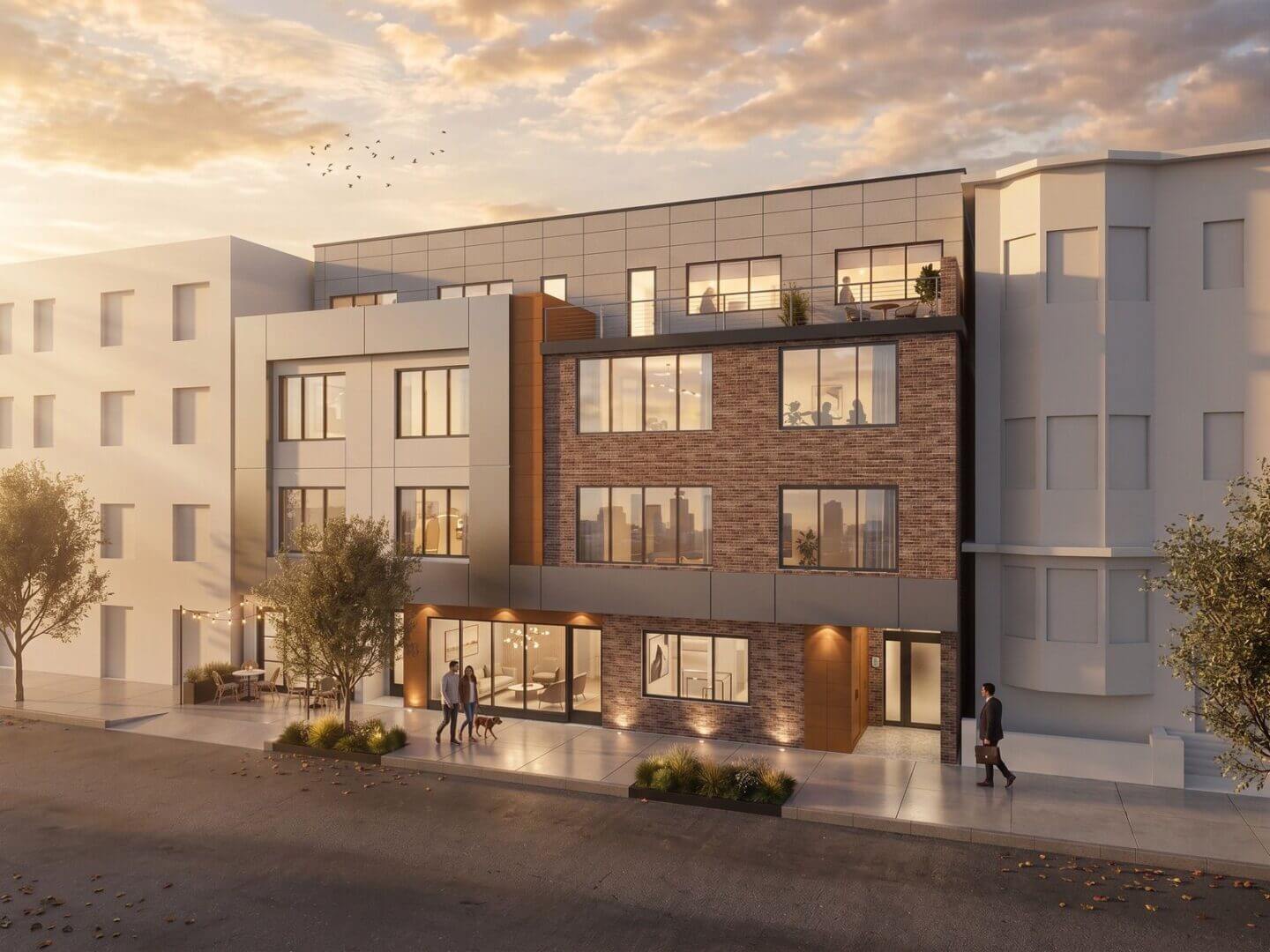 Modern brick and metal panel apartment building at sunset with lit interiors, a couple walking a dog, and a rooftop terrace above