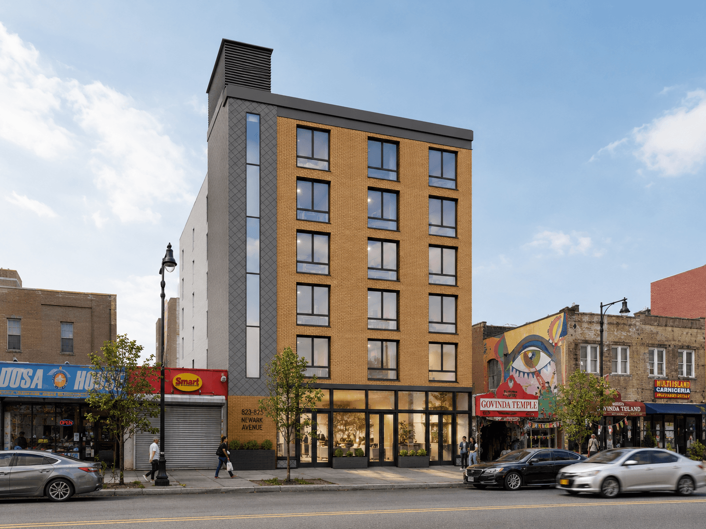 Six-story tan brick apartment building at 823-825 Newark Avenue on a busy street lined with local shops and traffic